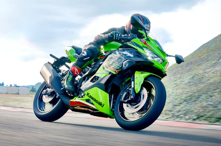Kawasaki Ninja ZX4RR front right side riding image on track